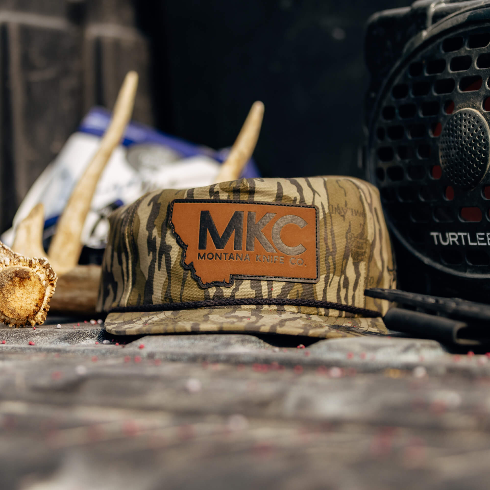 MKC X MOSSY OAK ROPE HAT - BOTTOMLAND