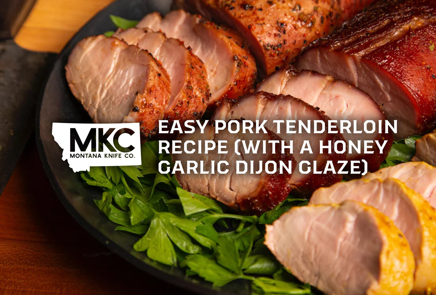 Glazed pork tenderloin with honey and Dijon, resting on fresh rosemary and thyme.