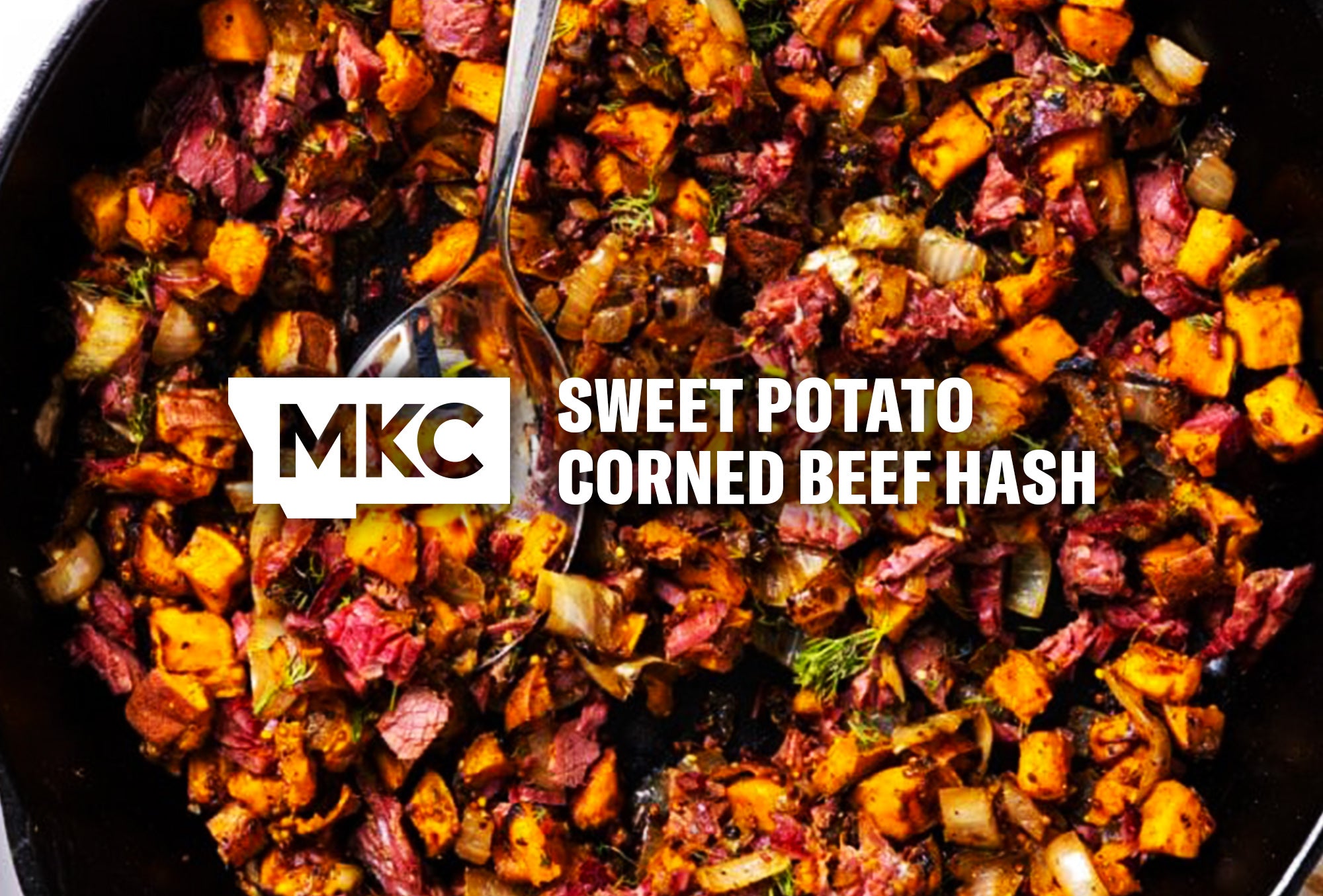 Sweet potato corned beef hash with diced sweet potatoes, chopped corned beef, onions, and herbs cooked in a skillet.