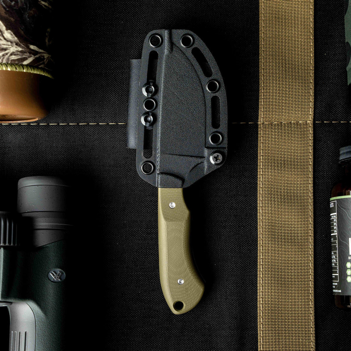 SOLD OUT MKC Elk Knife with a green handle and black sheath, designed for outdoor enthusiasts and hunters.